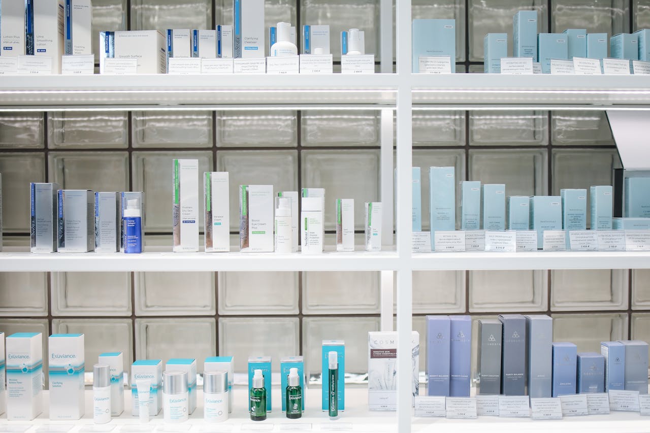 A clean and organized display of skincare products on shelves, perfect for beauty enthusiasts.